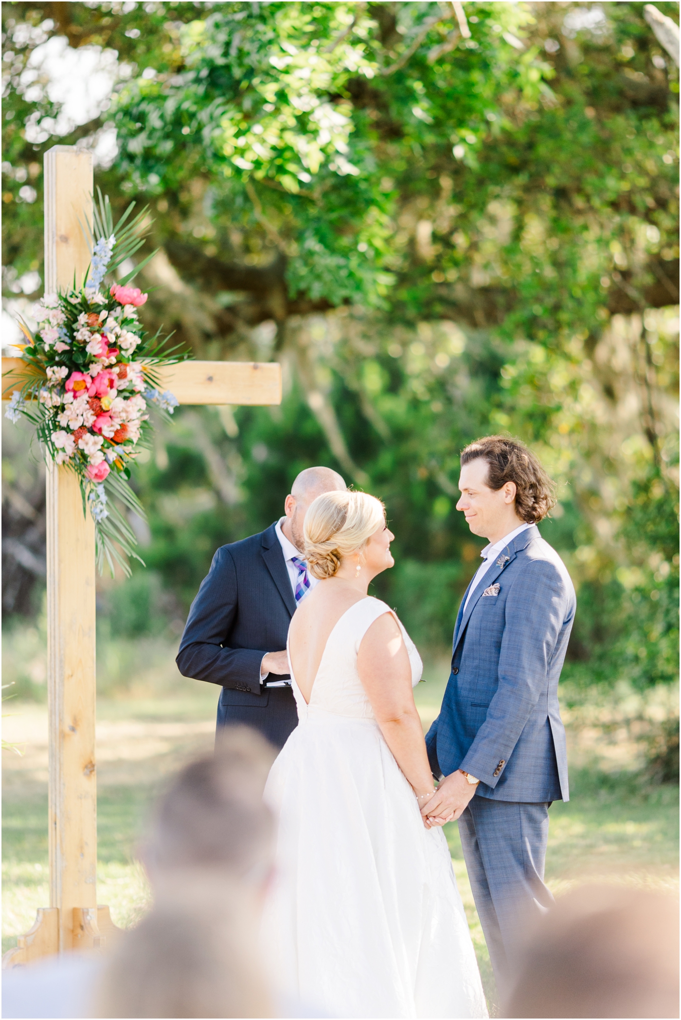 bride and groom saying vows at Agapae Oaks Weddings in Beaufort SC