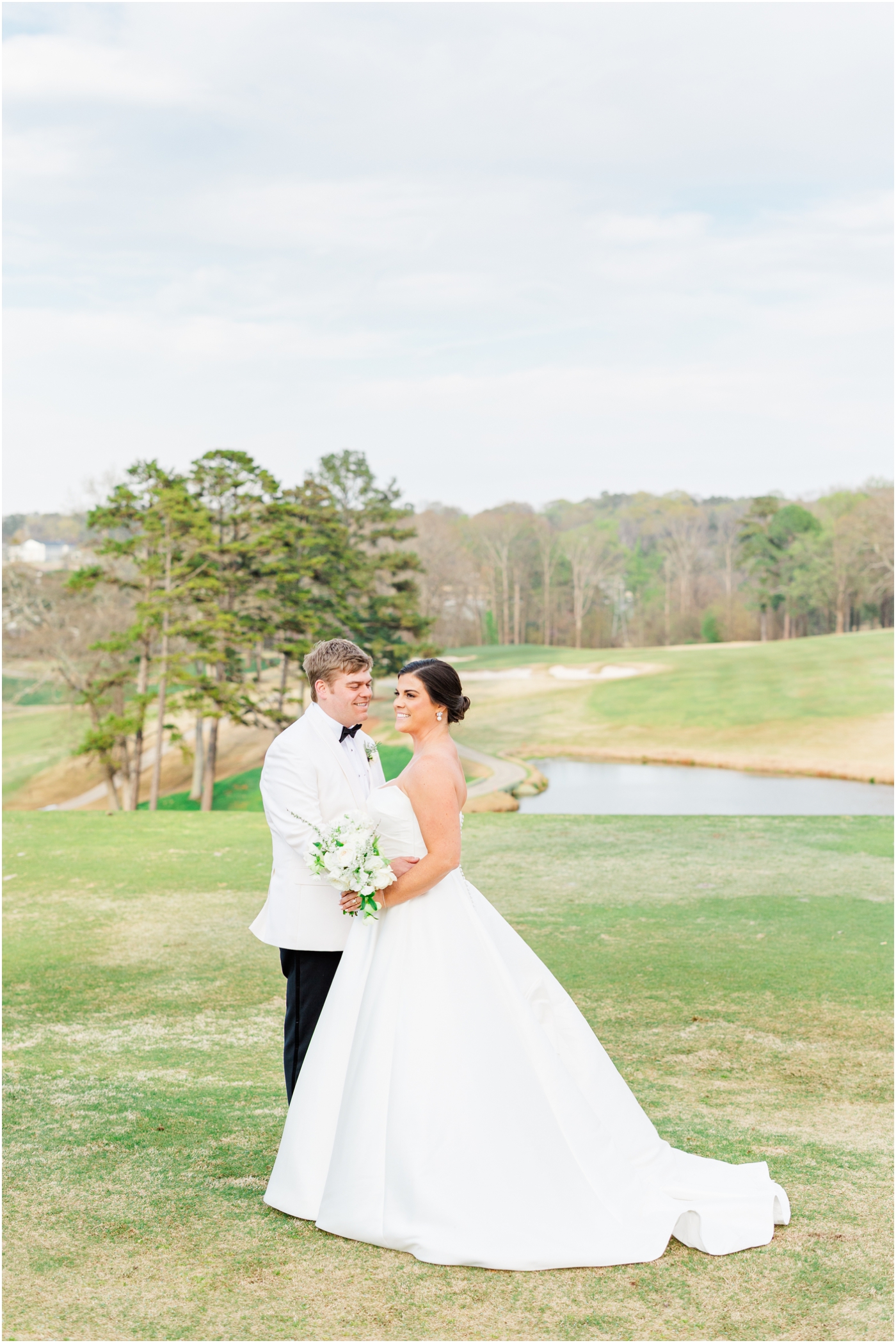 Bride & groom on golf course at greenville country club wedding | Greenville Wedding Photographer