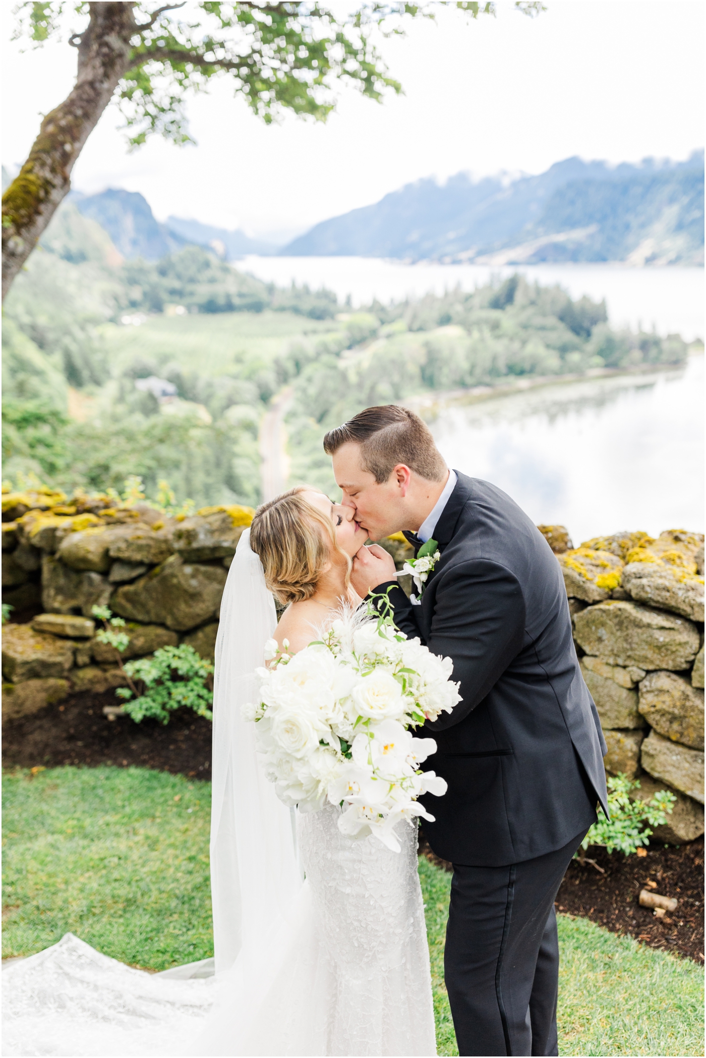 bride and groom with view of Columbia river gorge