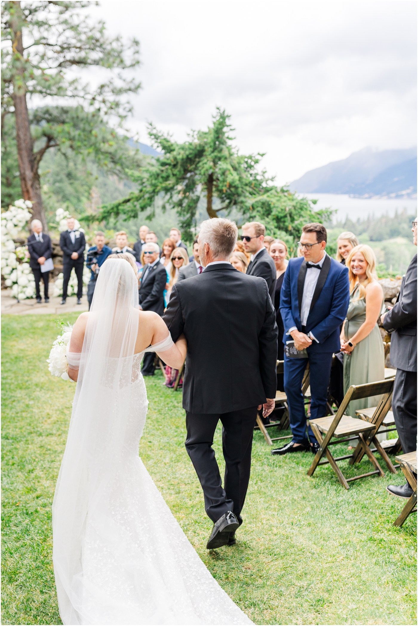 bride walking down aisle with Mountain View