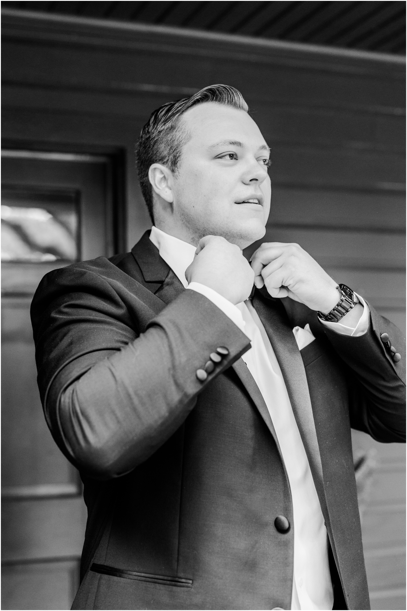 groom getting ready in suit