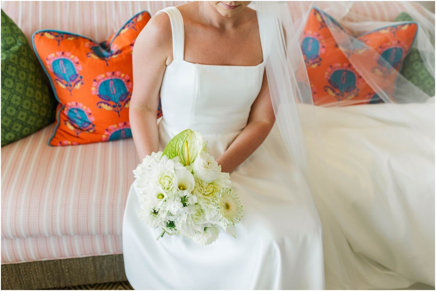 brides bouquet as she sits on couch at the coral bay club in Atlantic Beach