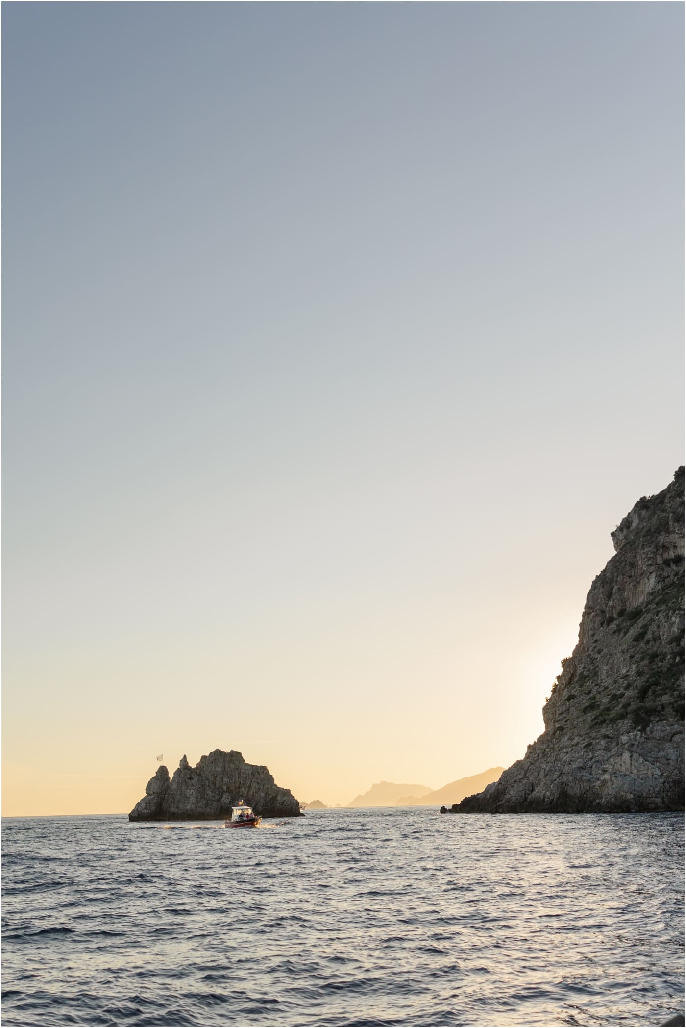 sunset on the water during a boat tour in Positano italy 