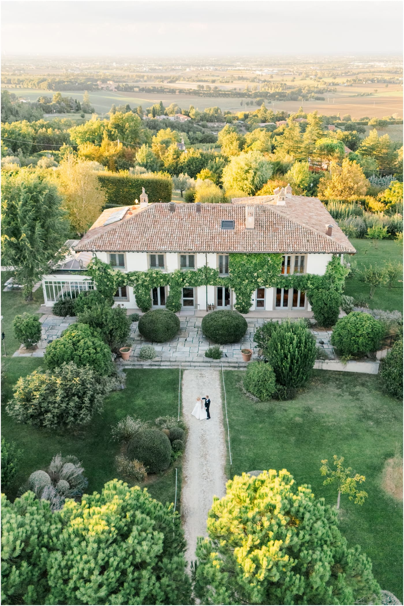 drone view of bride and groom outside of italy wedding villa 