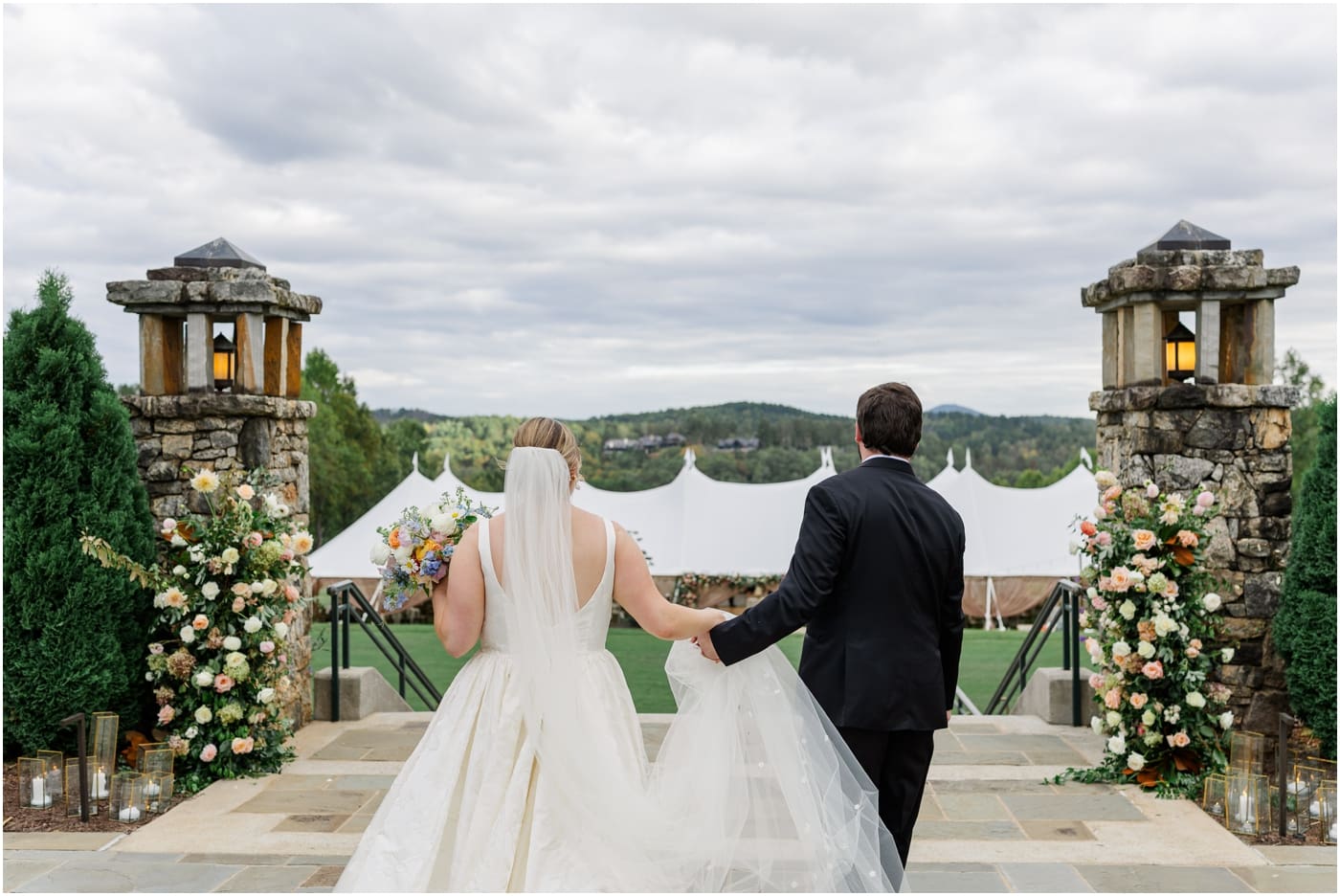 bride and groom admiring sailcloth tent at reserve at lake keowee wedding