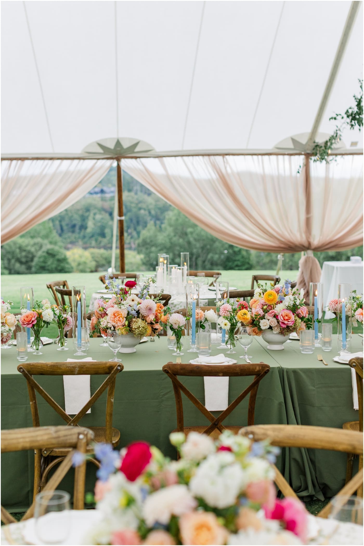 Colorful florals on green tablecloths at reserve at lake keowee wedding