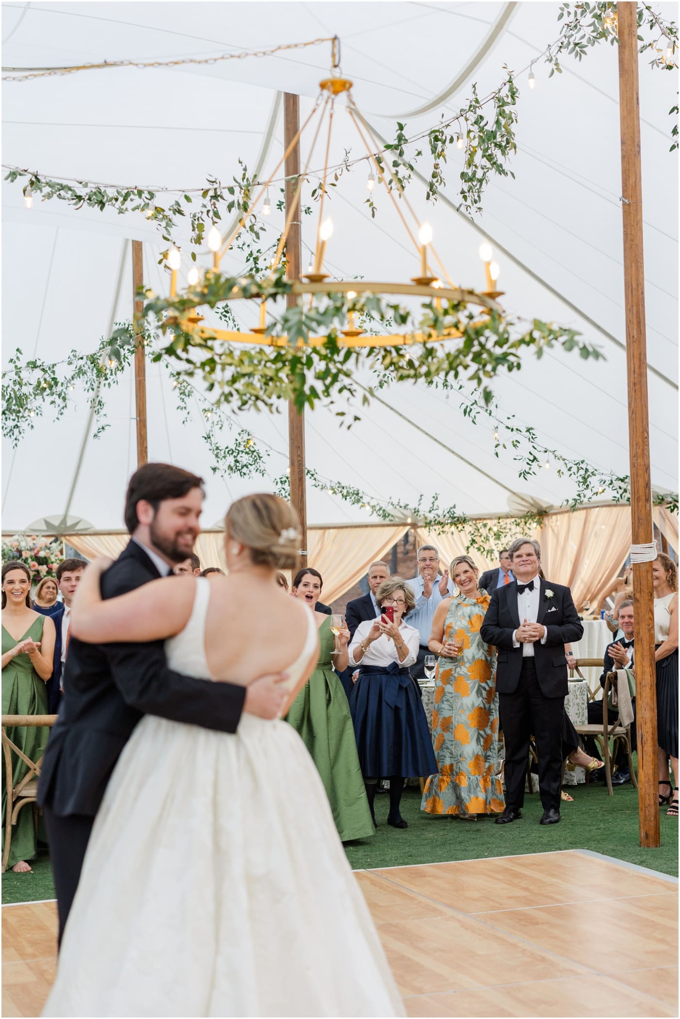 Parents of the bride watching first dance at reserve at lake keowee wedding
